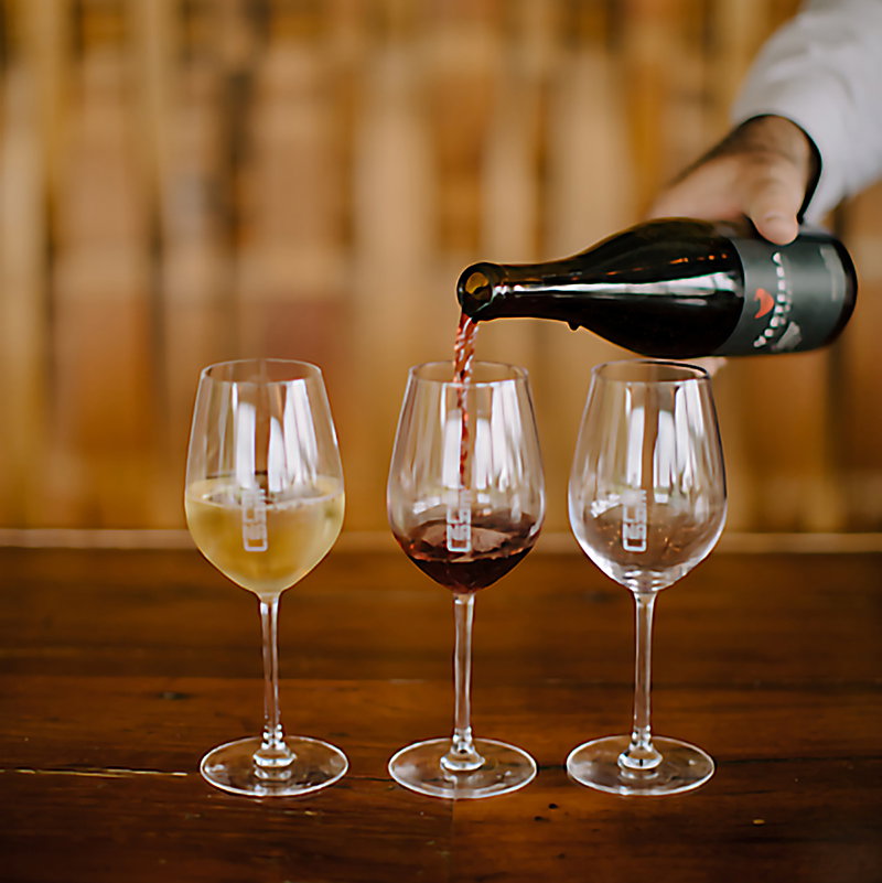 Pinot Noir being poured into a glass.